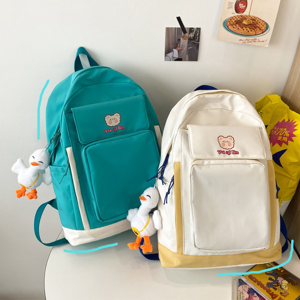 Esitasku ja laiade rihmadega tekstiilist seljakott naistele