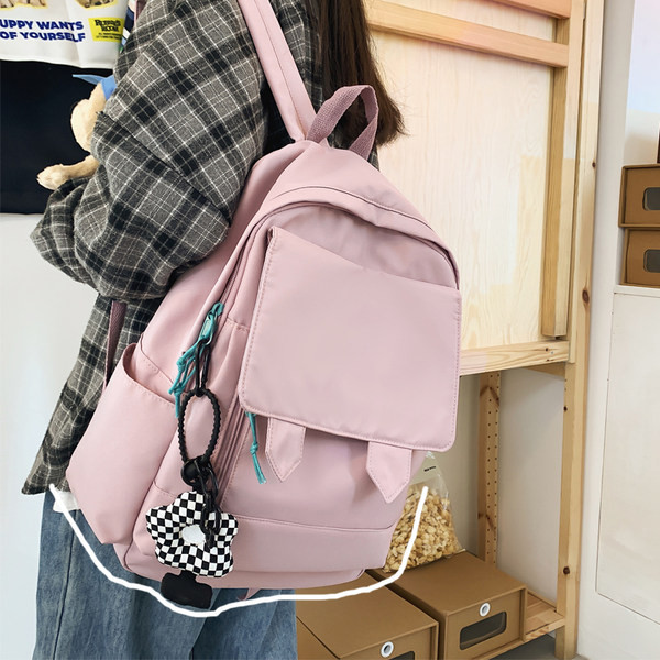 Lihtne tekstiilist naiste kooliseljakott