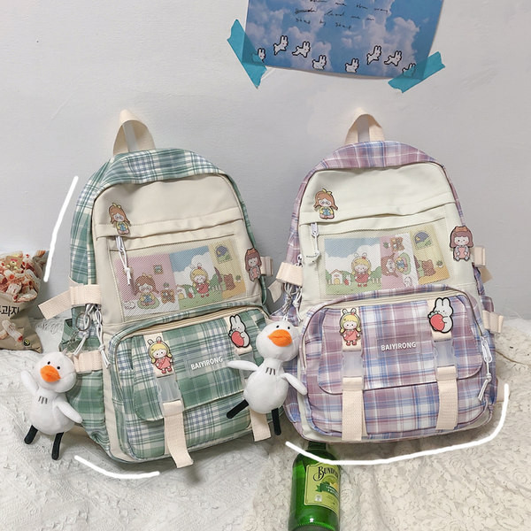 Tekstiilist värvilise mustriga seljakott ja võtmehoidja