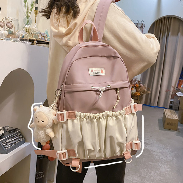 Naiste tekstiilist seljakott esitasku ja lukuga