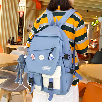 Taskute ja embleemiga lõuendist käekott