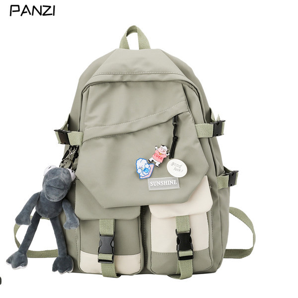 Taskute ja embleemiga lõuendist käekott