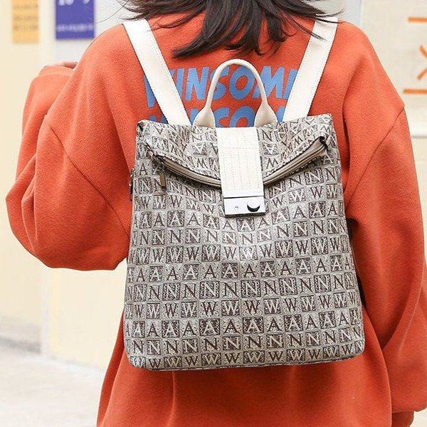 Naiste seljakott trükise ja metallist kinnitusega