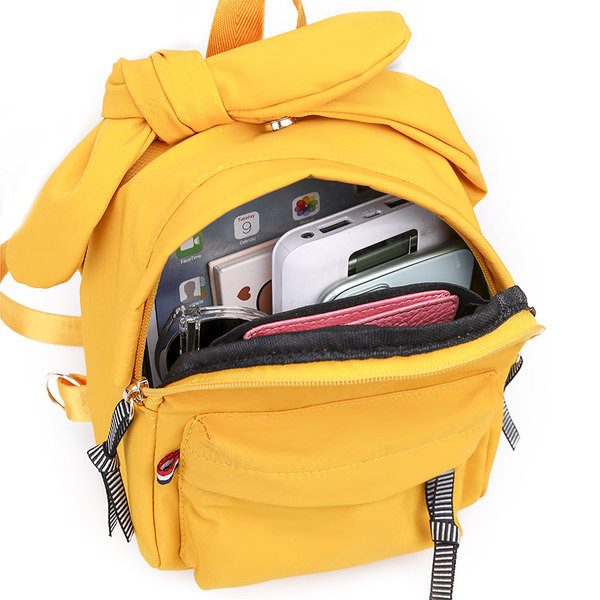 Naiste seljakott paela ja esitaskuga