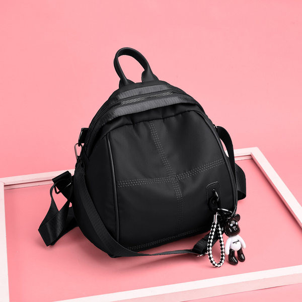 Naiste seljakott ripatsiga - kolme värvi