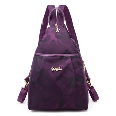 Kolmnurkne tekstiilist seljakott ja metallist kiri