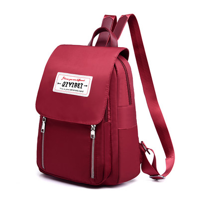 Γυναικείο υφασμάτινο σακίδιο πλάτης με έμβλημα και μεταλλικό κούμπωμα