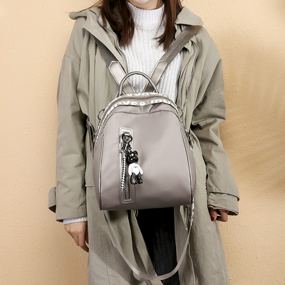 Naiste igapäevane seljakott eesmise luku ja ripatsiga