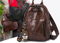 Női alkalmi bőr hátizsák fekete és barna zsebekkel