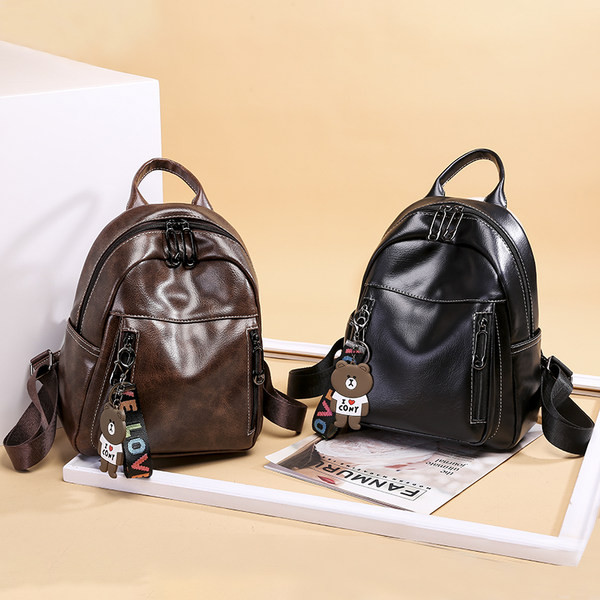 Női alkalmi bőr hátizsák fekete és barna zsebekkel