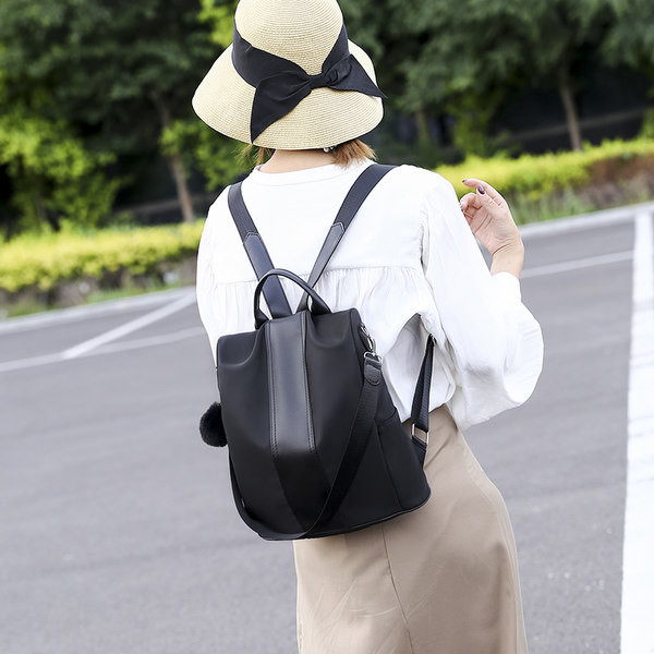 Naiste ühevärviline seljakott neljas värvitoonis udusulgedega