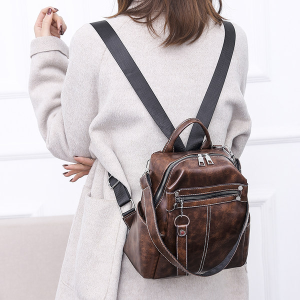 Uue mudeli kunstnahast naiste seljakott - must ja pruun