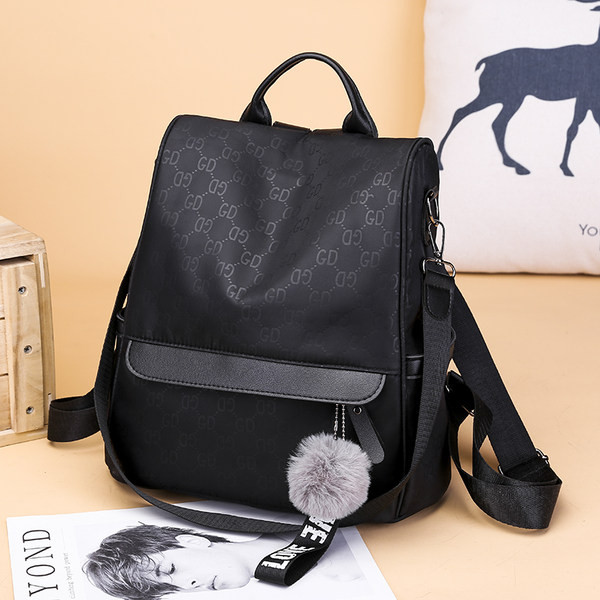 Must naiste seljakott esitasku ja sulekaunistusega