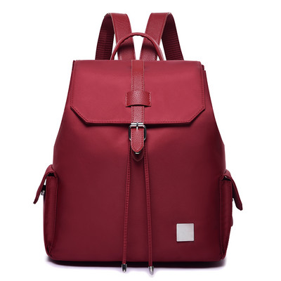 Γυναικεία τσάντα με πλαϊνές τσέπες σε τρία χρώματα