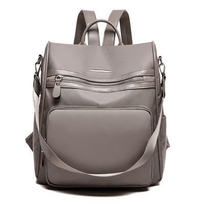 Praegune naiste tekstiilist seljakott luku ja taskuga