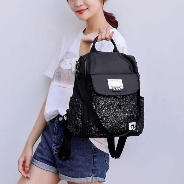 Mitmes värvitoonis tekstiilist sangaga naiste seljakott