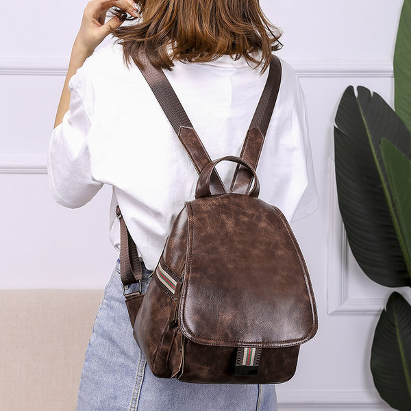 Väike ökonahast seljakott tekstiilosadega