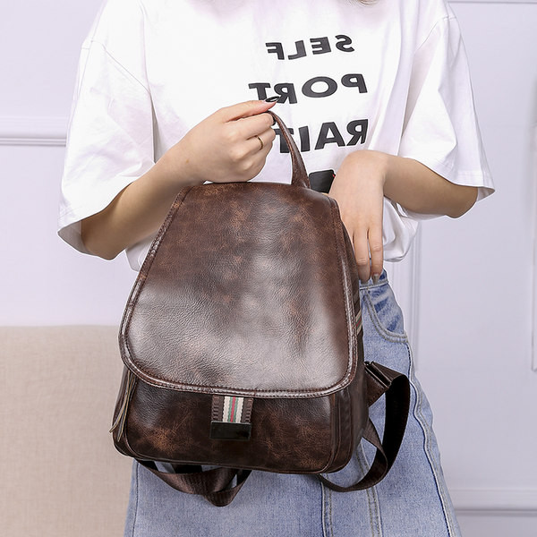 Väike ökonahast seljakott tekstiilosadega