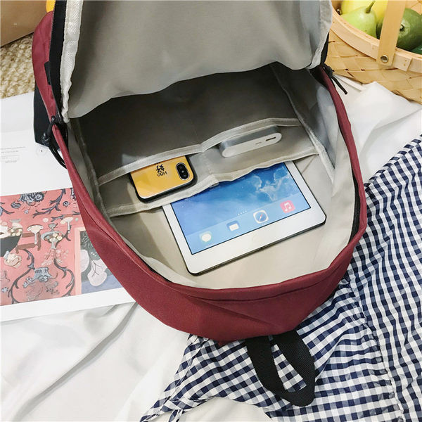 Naiste lõuendist seljakott embleemi ja esitaskuga