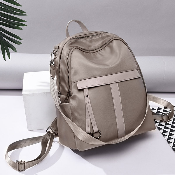 Kolmes värvitoonis sangadega naiste seljakott