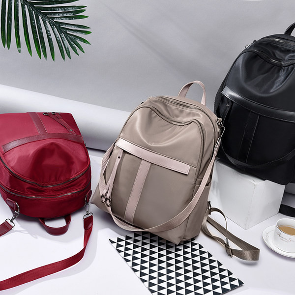 Kolmes värvitoonis sangadega naiste seljakott