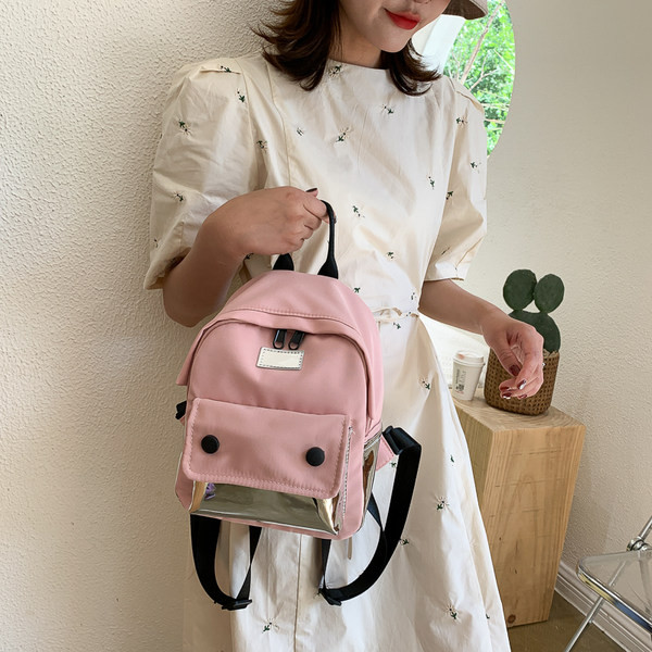 Väike naiste tekstiilist taskuga seljakott