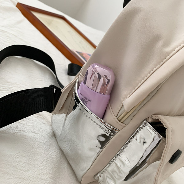 Väike naiste tekstiilist taskuga seljakott