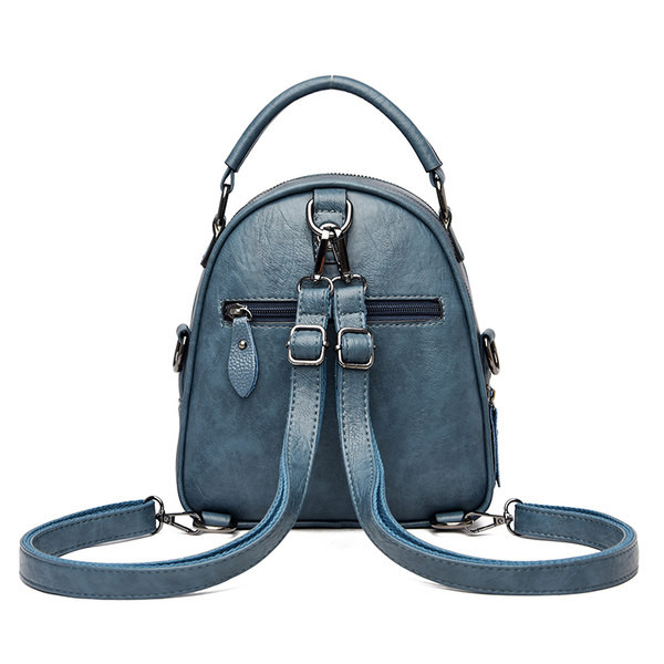 Öko-nahast väike naiste seljakott metallist embleemiga