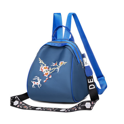 Kolmes värvitoonis tikandiga naiste seljakott