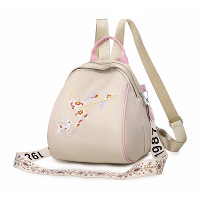 Kolmes värvitoonis tikandiga naiste seljakott