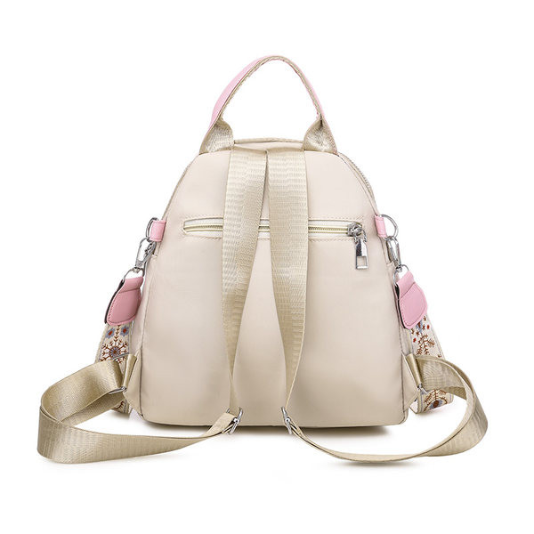 Kolmes värvitoonis tikandiga naiste seljakott