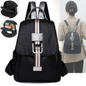 Musta värvi metallist elemendiga väike naiste seljakott