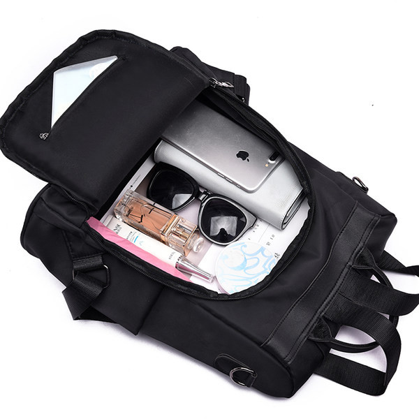 Naiste moodne tekstiilist seljakott eesmise luku ja taskuga