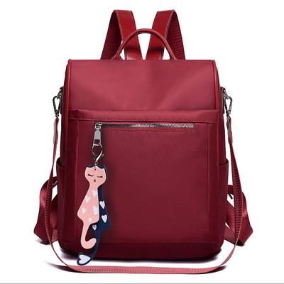 Naiste tekstiilist seljakott tekstiilist eesmise lukuga