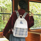 Naiste ruuduline tekstiilist taskuga seljakott