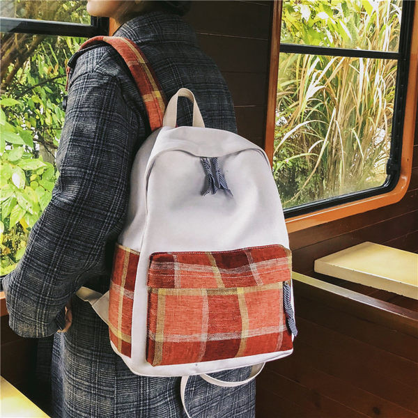 Naiste ruuduline tekstiilist taskuga seljakott