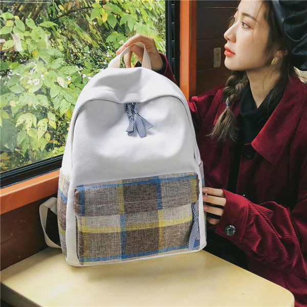 Naiste ruuduline tekstiilist taskuga seljakott