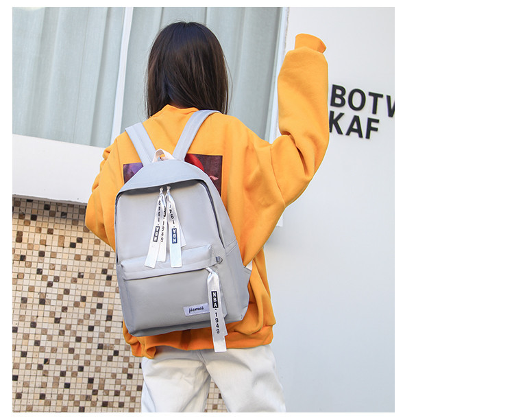 Modern iskolai textil hátizsák elülső zsebbel