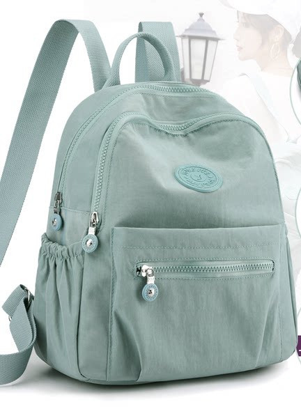 Naiste tekstiilist seljakott mitmes värvitoonis – veekindel