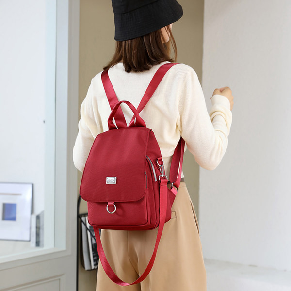 Naiste tekstiilist metallist kinnitusega seljakott