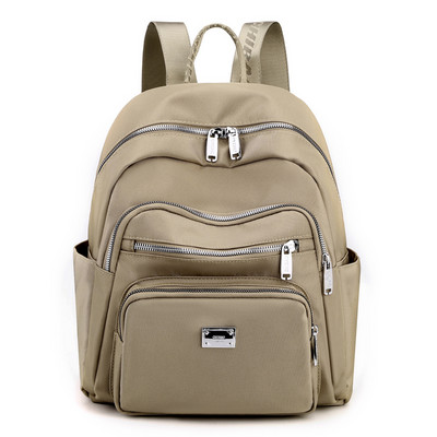 Metallist kaunistusega tekstiilist seljakott naistele