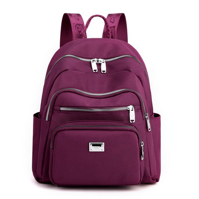 Metallist kaunistusega tekstiilist seljakott naistele