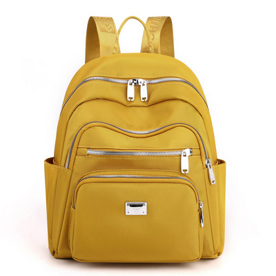 Metallist kaunistusega tekstiilist seljakott naistele