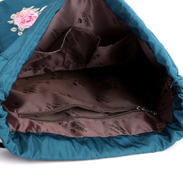 Tikandiga naiste tekstiilist kott - mitut värvi