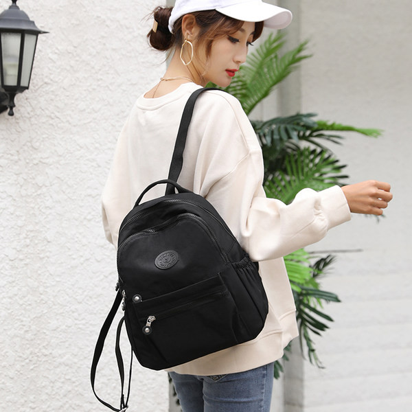 Tekstiilist veekindel seljakott mitmes värvitoonis