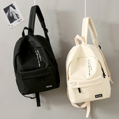 Igapäevane tekstiilist seljakott kirjadega