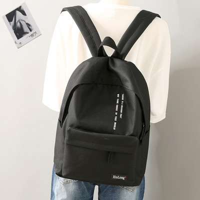 Igapäevane tekstiilist seljakott kirjadega