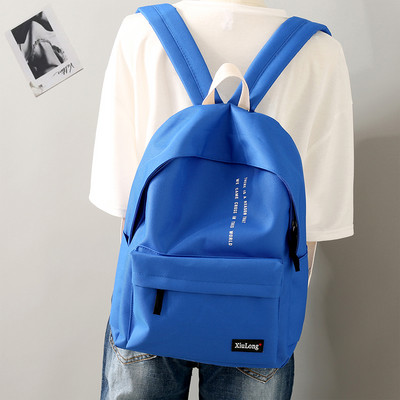 Igapäevane tekstiilist seljakott kirjadega