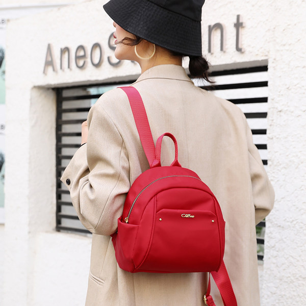 Naiste mini igapäevane seljakott tekstiilist ja metallist elemendiga