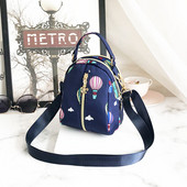 Naiste tekstiilist seljakott värvilise aplikatsiooniga